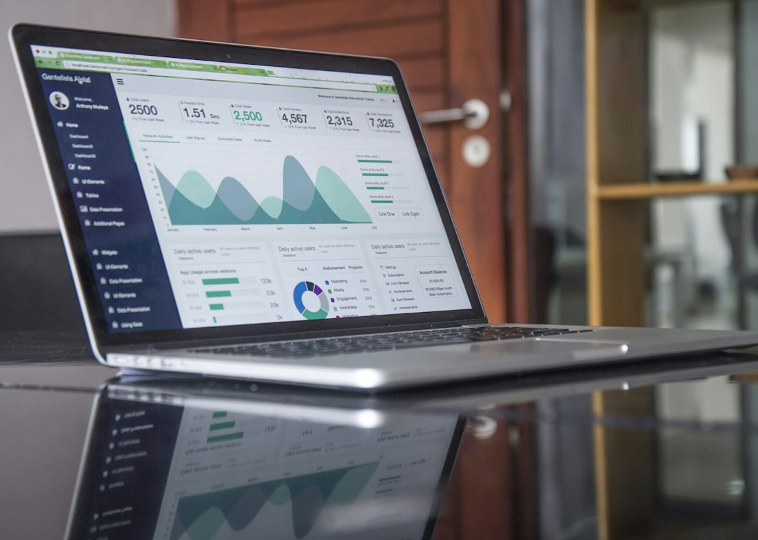 A laptop showing a financial dashboard